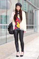 white faux fur jacket and leather pants