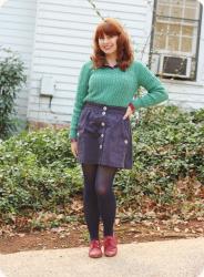 Cable Knit Over Flannel with a Navy Blue Skirt and Red Oxfords