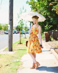 orange vintage sundresses and trying to open my eyes in the sunshine