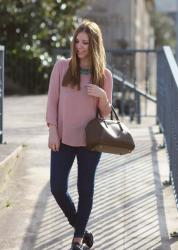 Pink shirt and blue and golden necklace