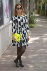 Black and white dress, yellow clutch 