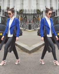 Blue Boucle Biker Jacket / White Polo Neck / High Bun