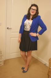 A bright blue blazer and lots of red lipstick....