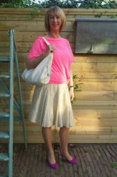 Pink T-shirt and a wide, silk skirt