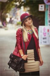 Burgundy riding jacket and feather necklace