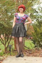 Outfit: Floral Crop Top, Leather Skater Skirt, Fishnet Tights, and Black Loafers