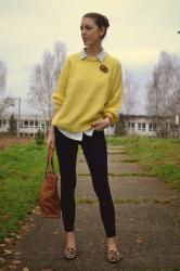 yellow sweater with knitting pretzel brooch 
