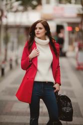 RED COAT AND WHITE TURTLENECK SWEATER