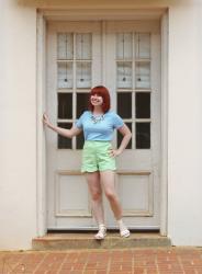 Outfit: Tree Branch Statement Necklace, Green Scallop Hem Shorts, and a Light Blue Textured Top