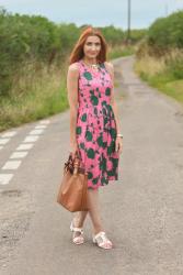 A Simple Floral Midi Dress With a Statement Necklace and Block Heels