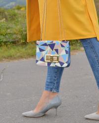 yellow long vest & geometric pattern bag