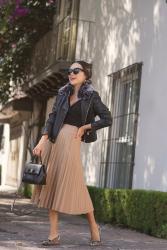 Leather jacket + pleated skirt