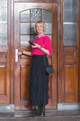 Tiered ruffle skirt with a bright pink jumper