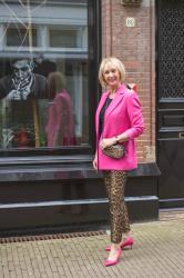 Bright pink jacket and leopard trousers