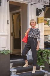 Black summer trousers with a black and white jumper