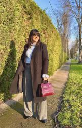 Grey Trousers with Pale Blue and Burgundy Bag. 