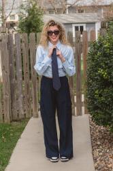 A Navy Necktie with Sneakers and Wide-leg Cargos.