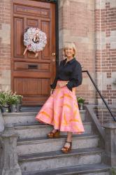 Patterned pink skirt with a black shirt
