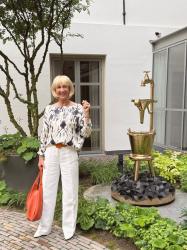 Wide white trousers with a blue and white top