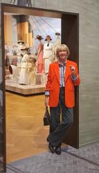 Orange blazer with a blue and white shirt at Titanic & Fashion Exhibition