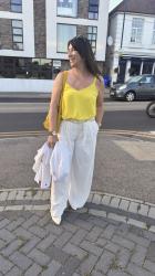 White Wide Leg Trousers With a Yellow Top.